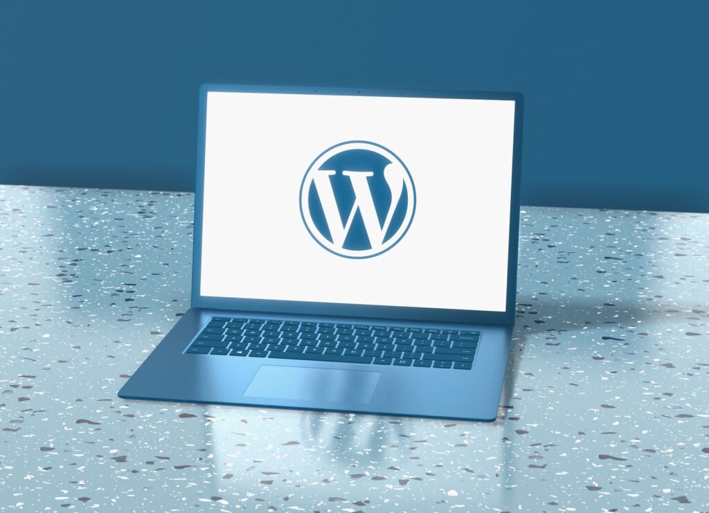Contentful vs WordPress a laptop computer sitting on top of a table